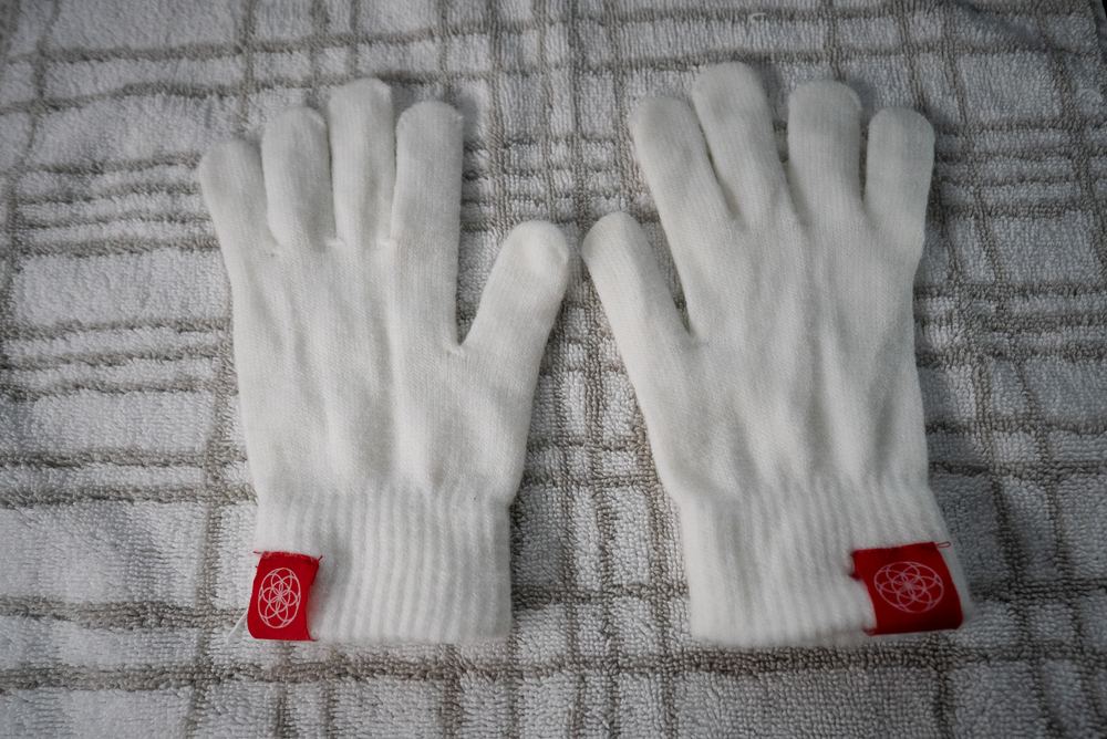 Hand-washed gloves laid flat to dry on a towel
