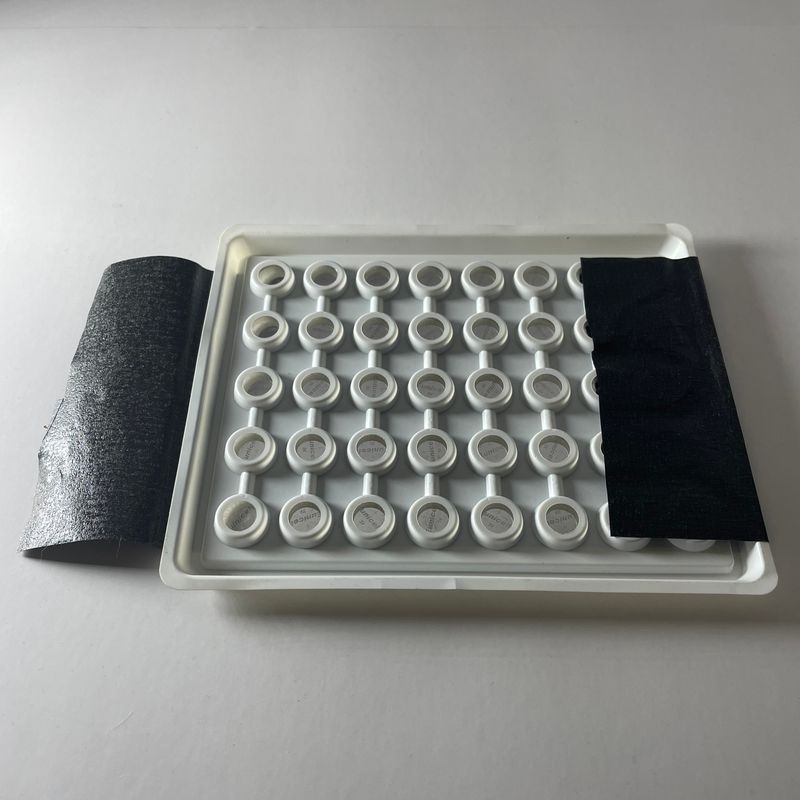 Tray of CR2032 coin-cell batteries with foil seal peeled back