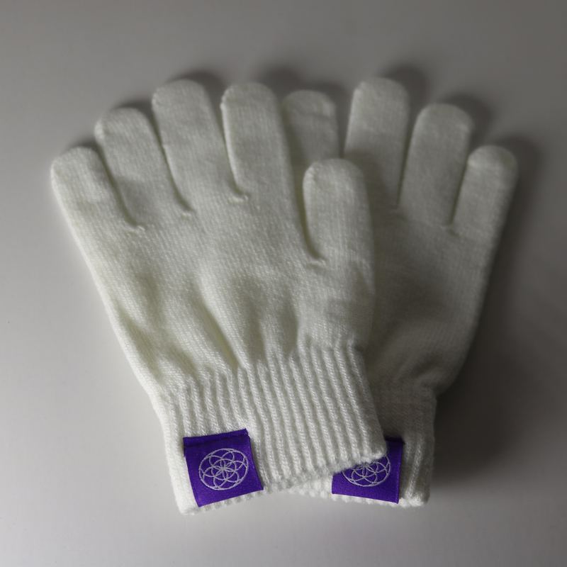 Plain white gloving glove pair laid flat