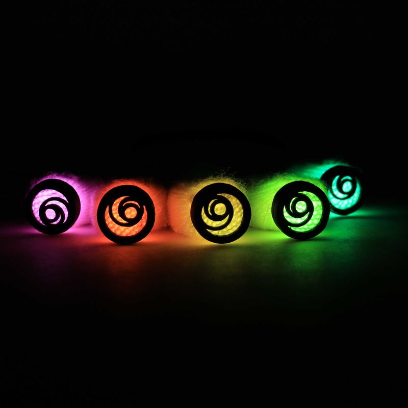 Five gyrosphere diffuser caps glowing in rainbow colors against a dark background